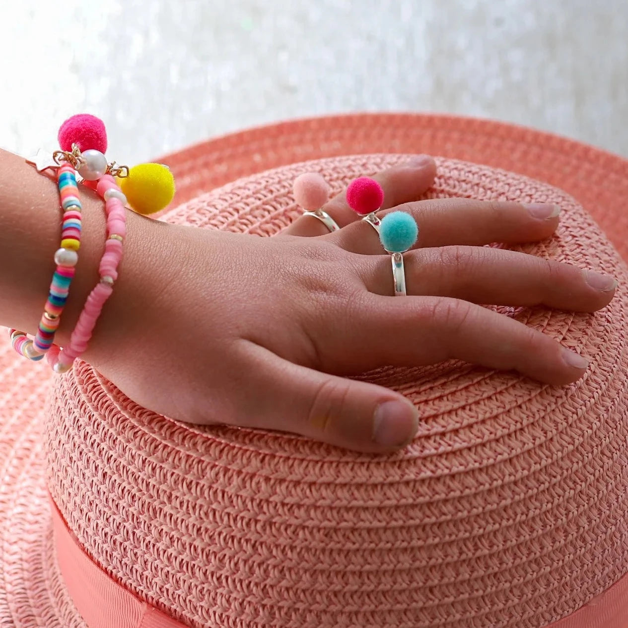 LAUREN HINKLEY POM POM ELASTIC BRACELET: PINK