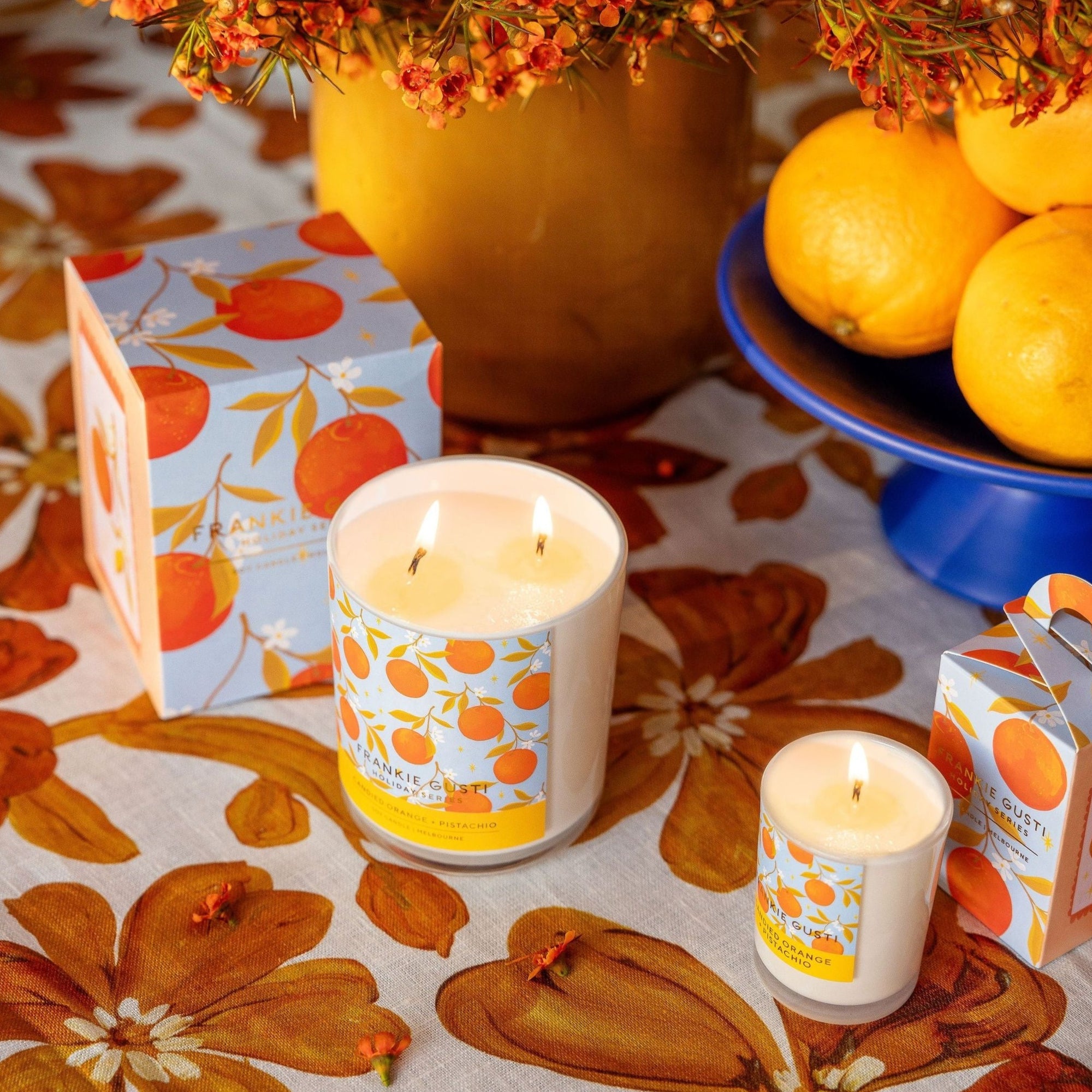 FRANKIE GUSTI HOLIDAY SERIES ORNAMENT CANDLE: CANDIED ORANGE + PISTACHIO