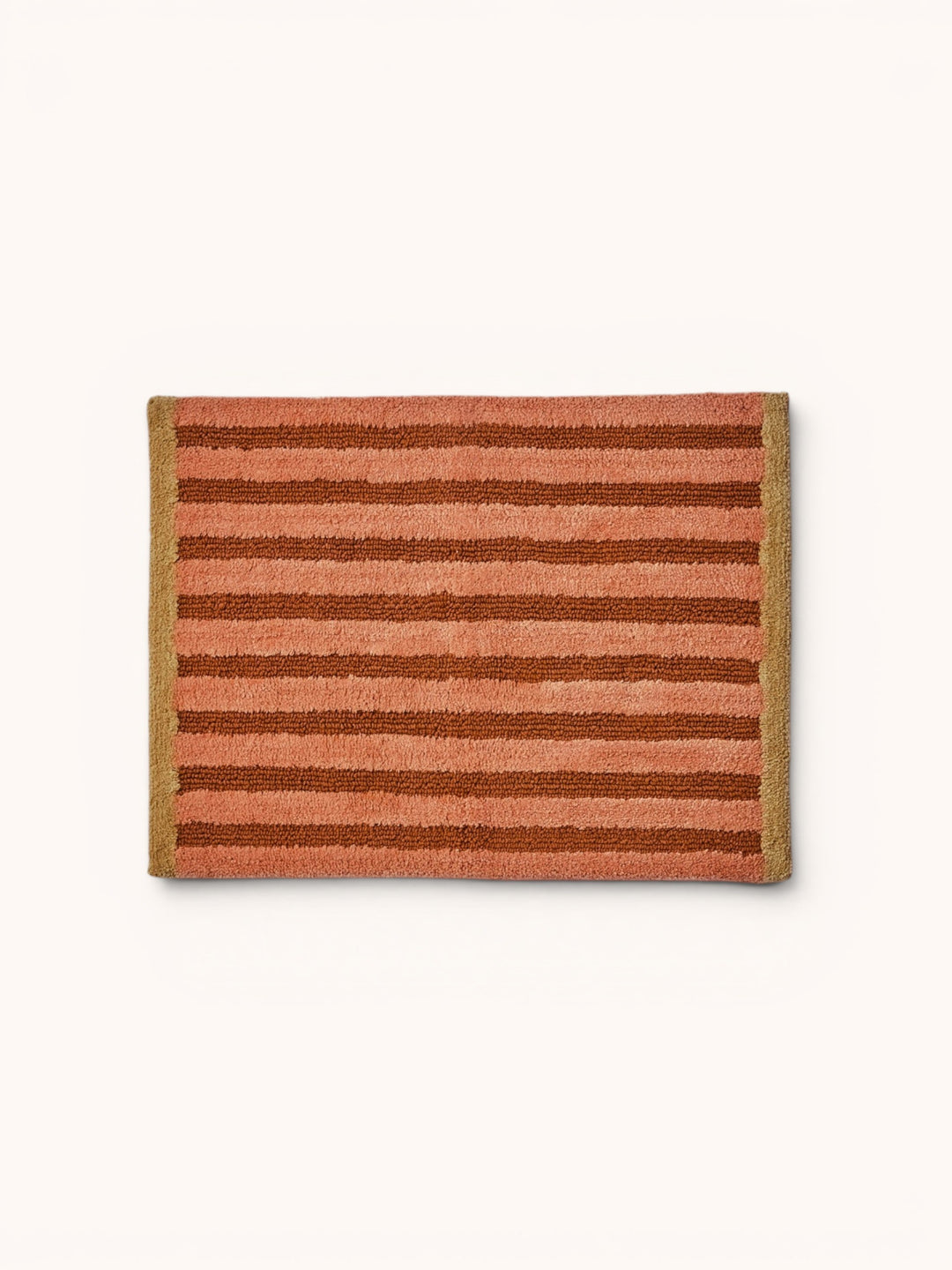 Bonnie and Neil stripe reversible bath mat in terracotta, in a bathroom