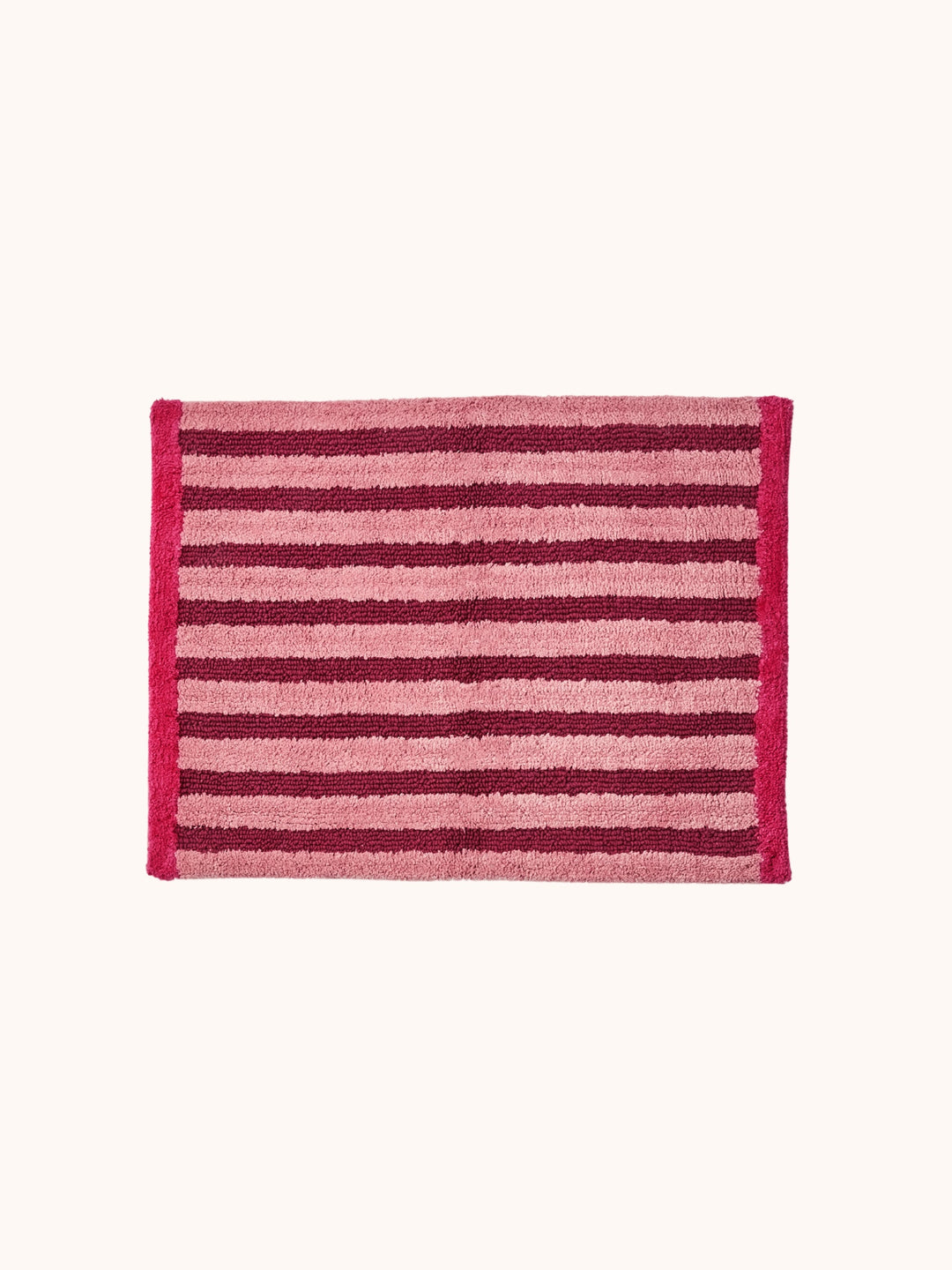 Bonnie and Neil stripe reversible bath mat in burgundy, styled