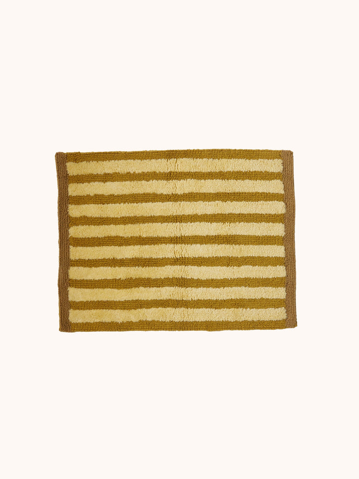 Bonnie and Neil stripe reversible bath mat in mustard, styled