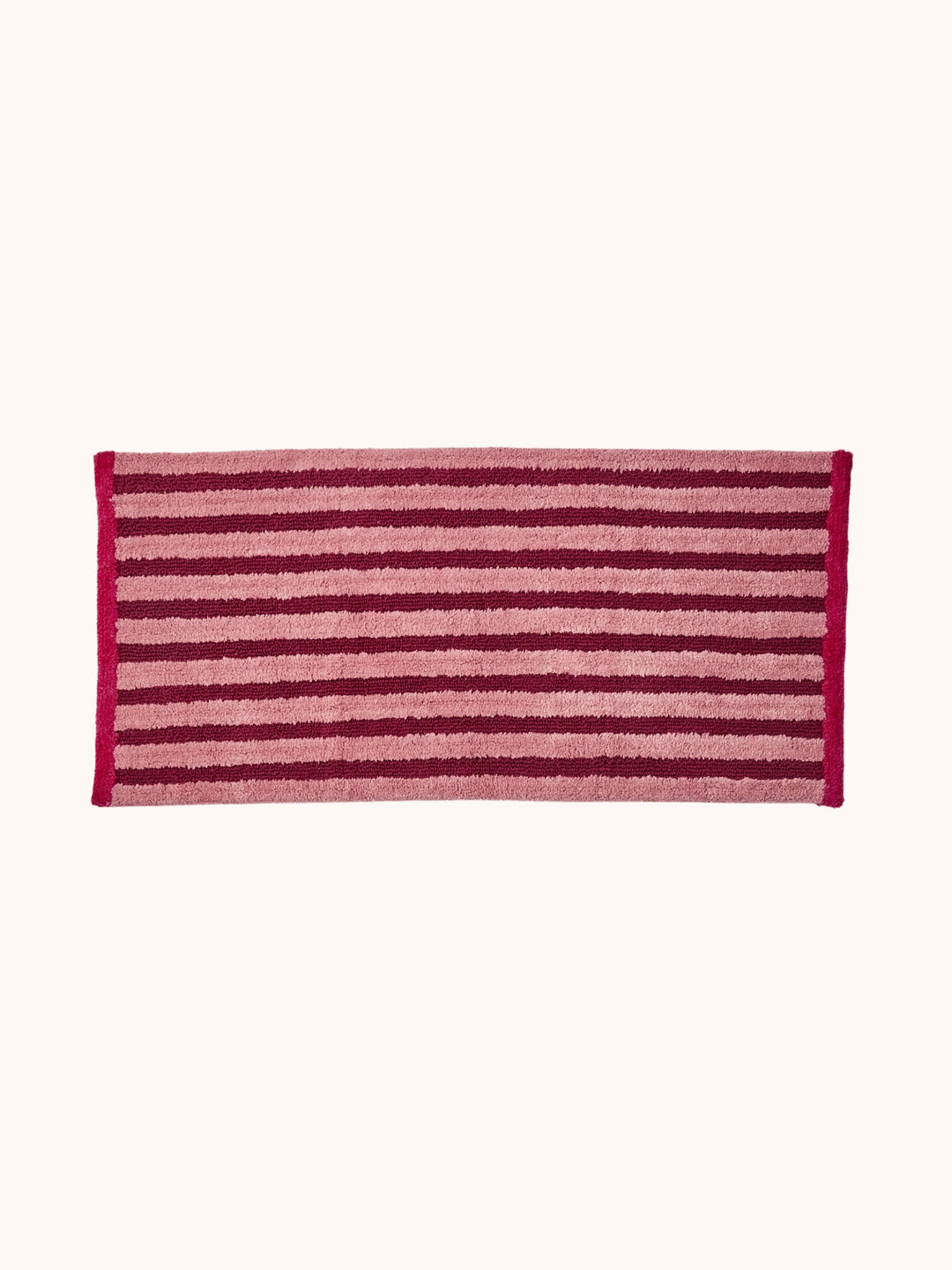 Bonnie and Neil stripe reversible long bath mat in burgundy, styled