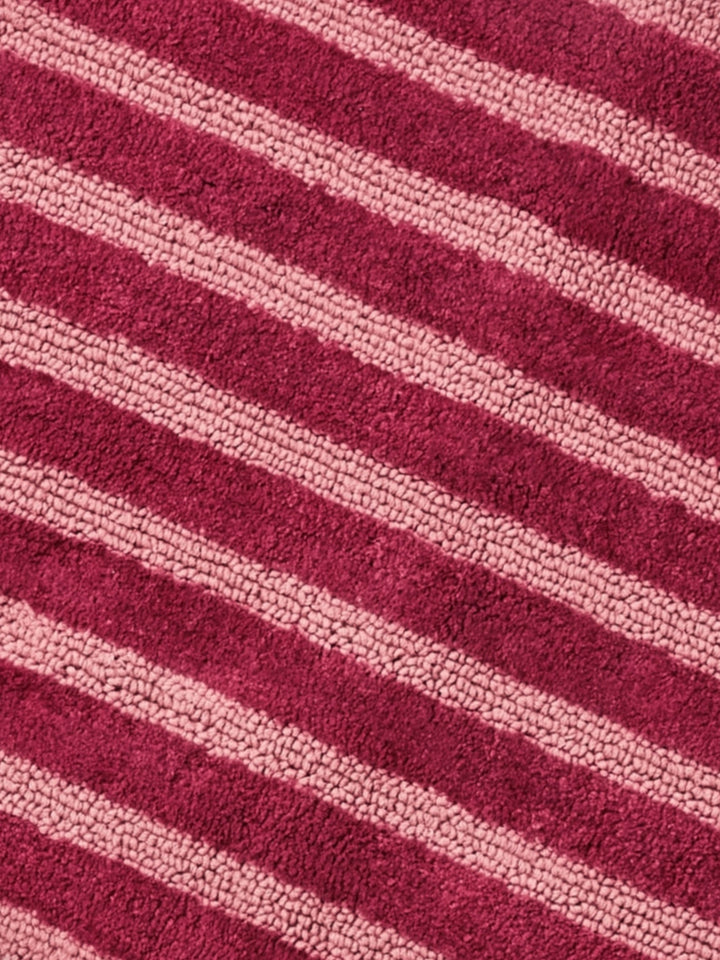 Bonnie and Neil stripe reversible long bath mat in burgundy, detail
