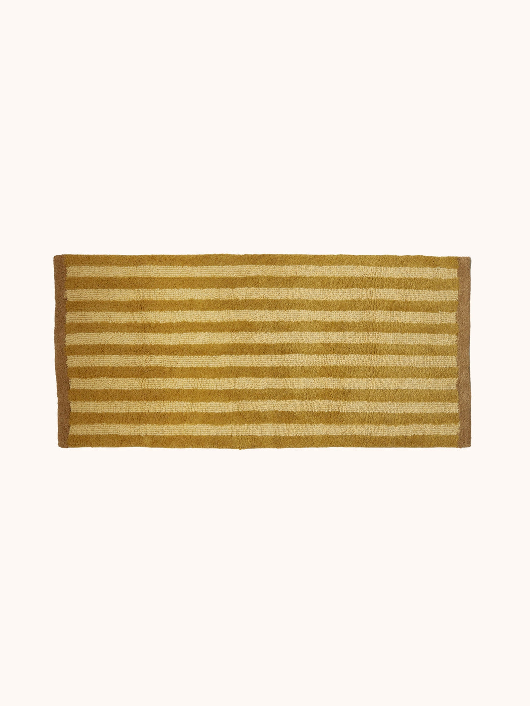 Bonnie and Neil stripe reversible long bath mat in mustard, in a bathroom