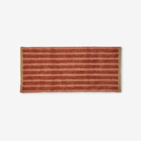 BONNIE AND NEIL STRIPE REVERSIBLE LONG BATH MAT: TERRACOTTA
