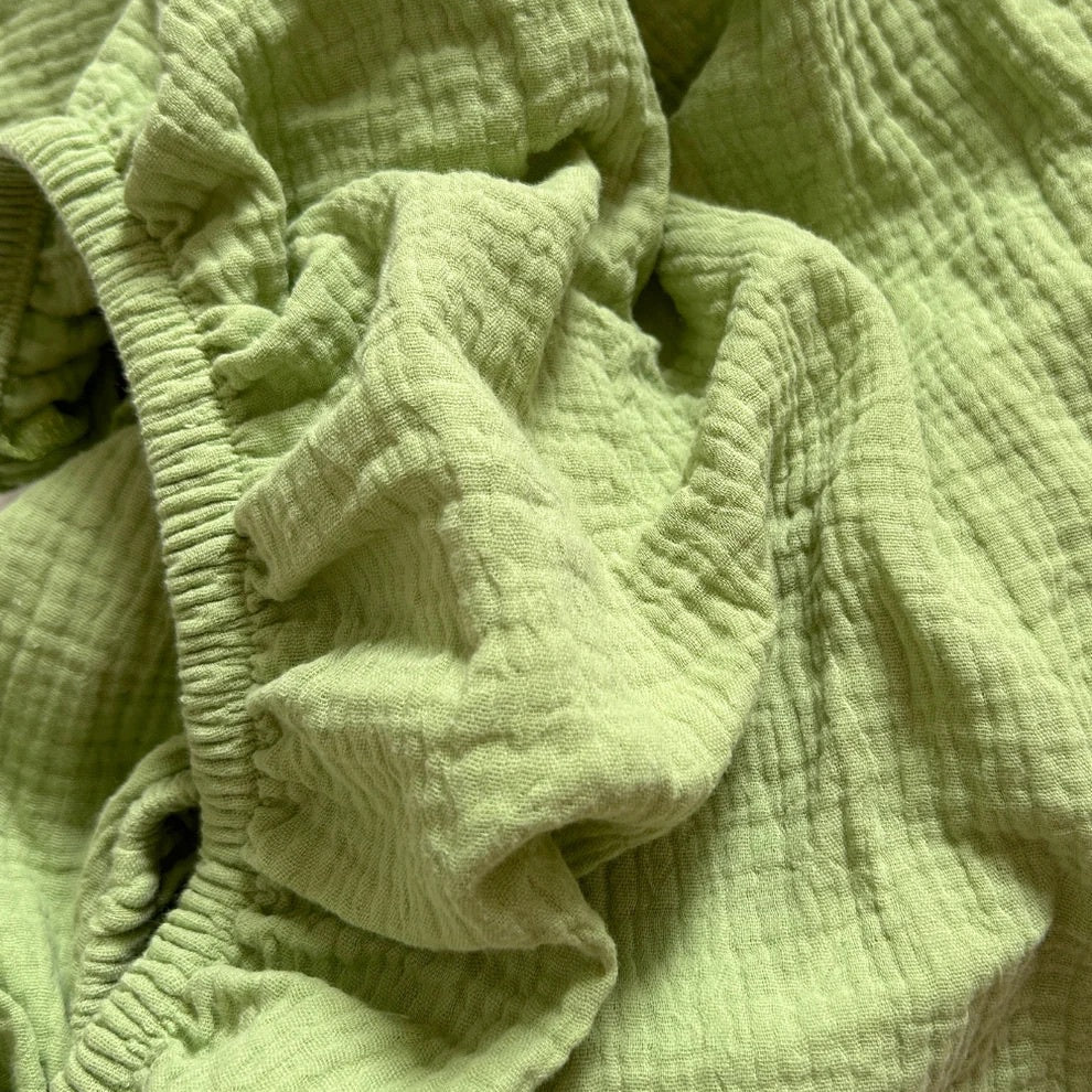 WORN CURATIONS BABY MUSLIN COT SHEET: APPLE
