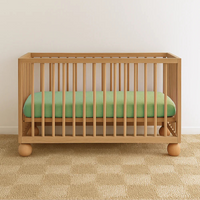 WORN CURATIONS BABY MUSLIN COT SHEET: APPLE