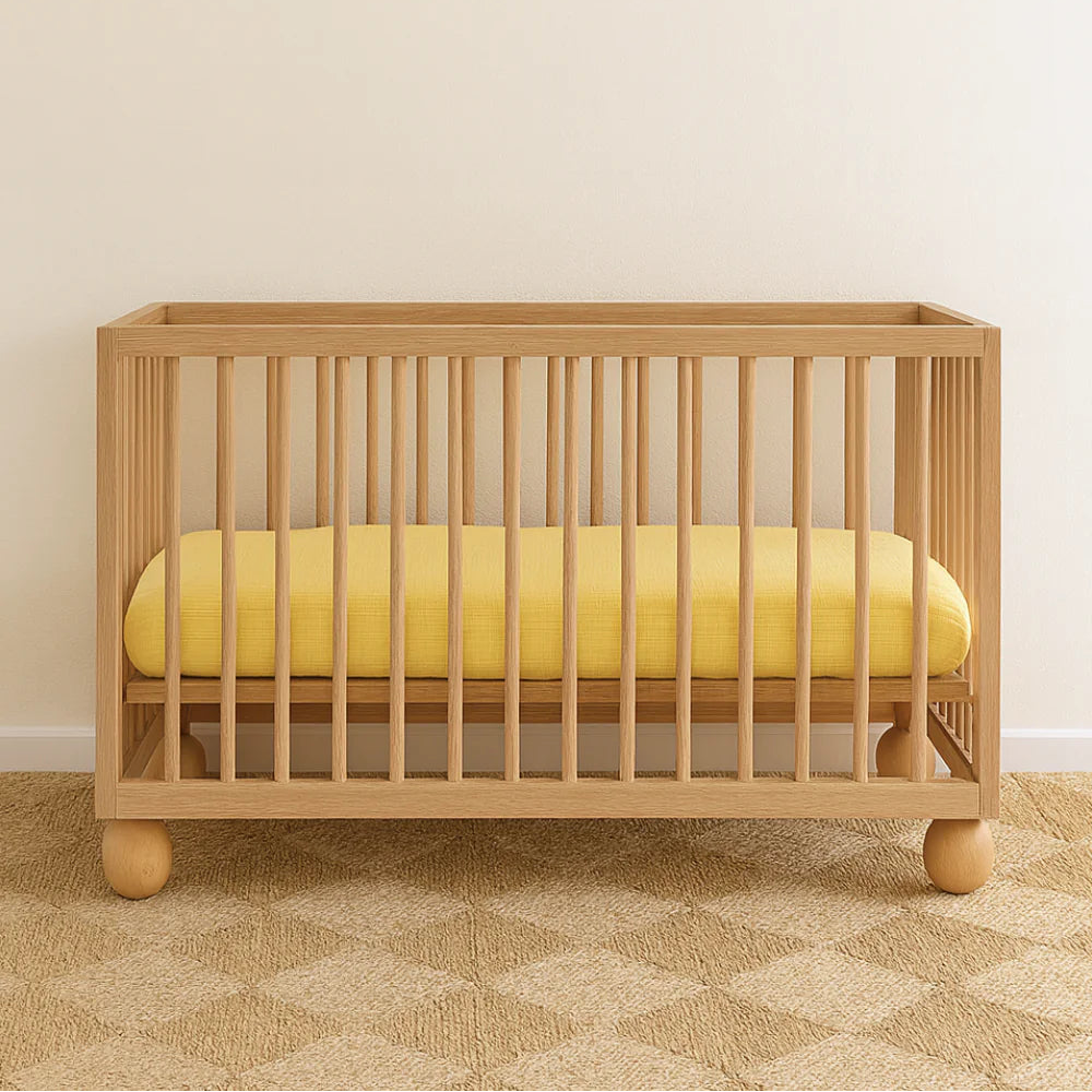 WORN CURATIONS BABY MUSLIN COT SHEET: BUTTER