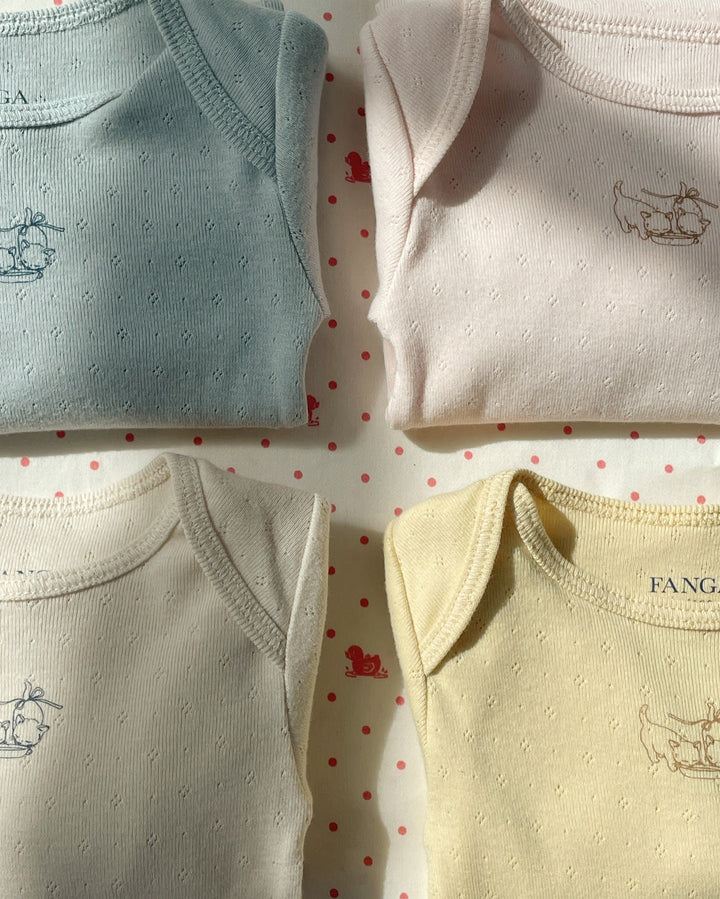 Konges Sløjd Perla LS Bodysuit 2pc buttercream/pearl blue flat lay