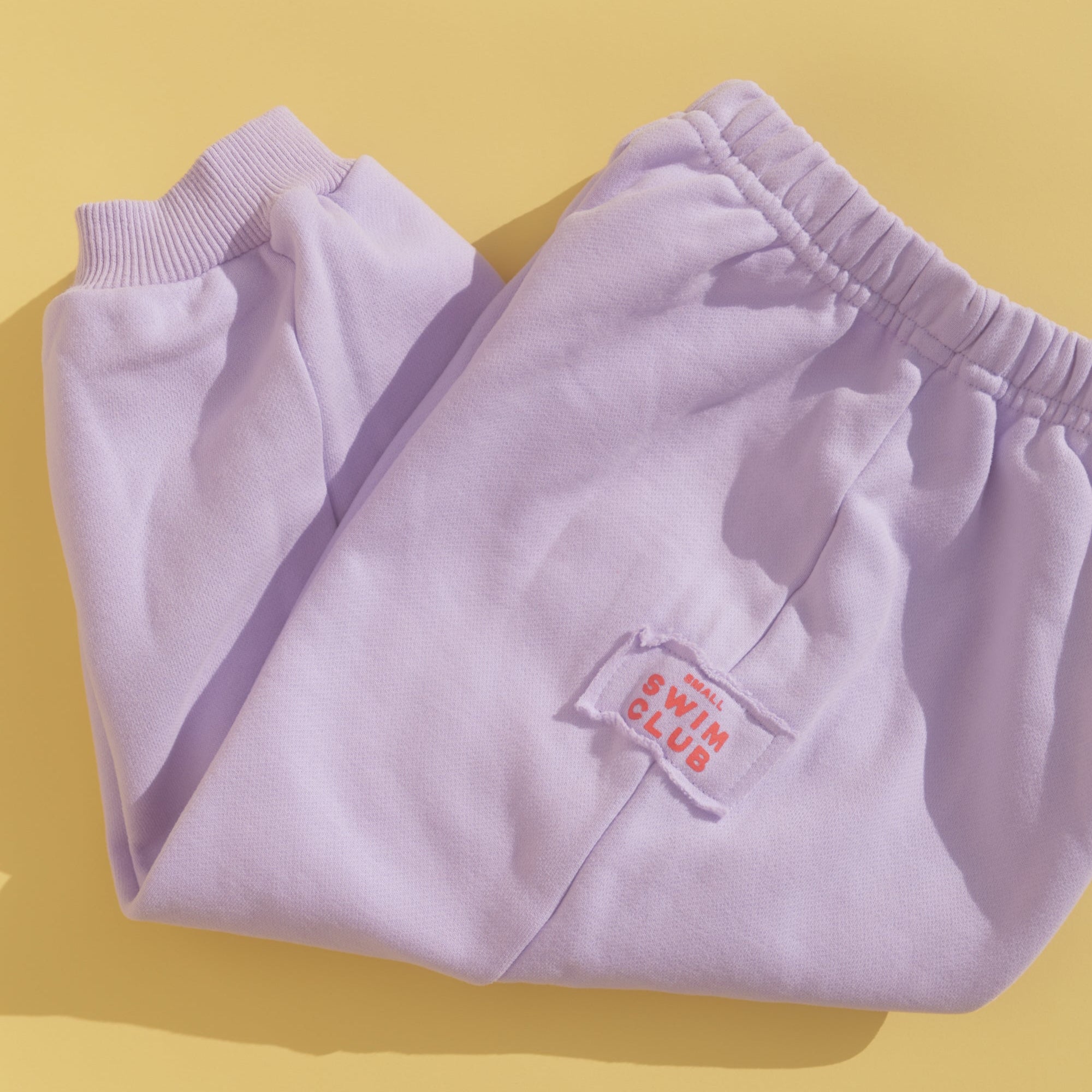 SMALL SWIM CLUB GOOD TRACKY DACKS: LILAC/RED