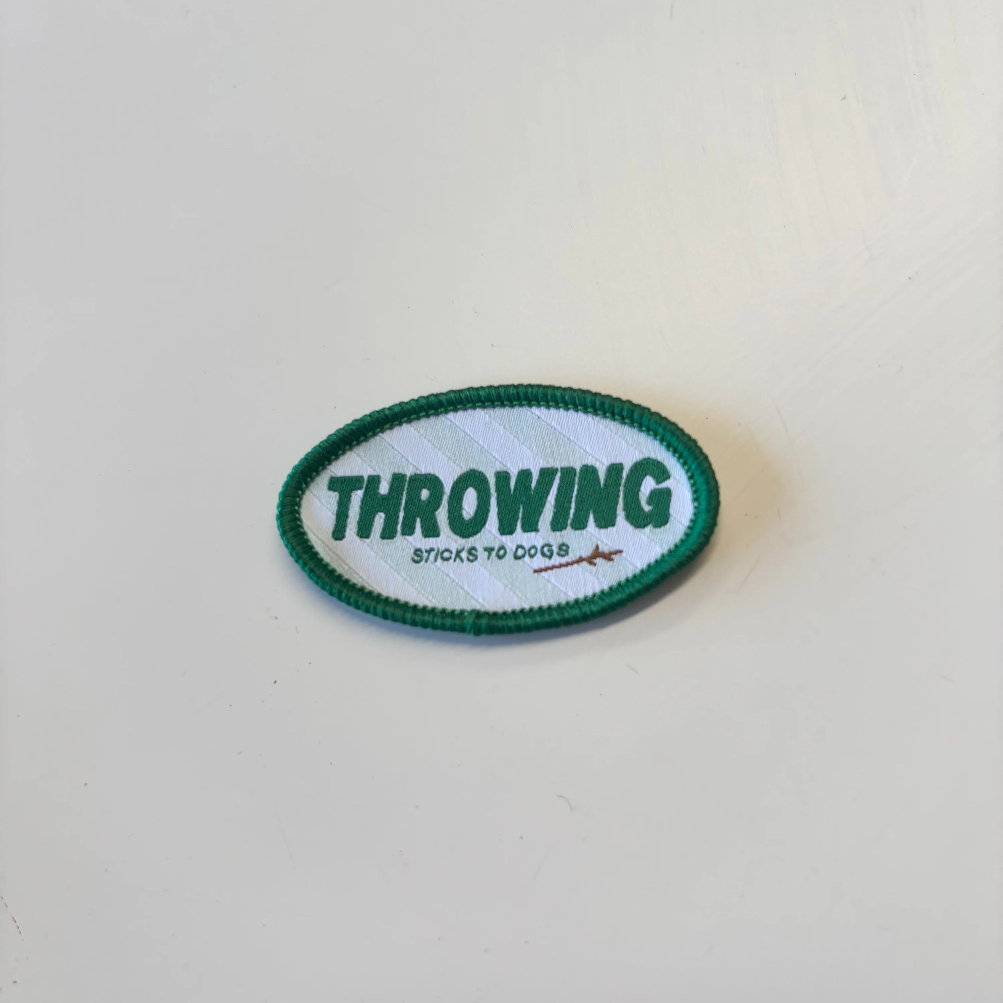 LENN LABEL PATCH: THROWING STICKS TO DOGS