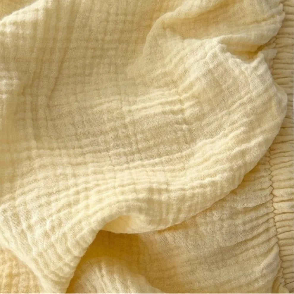 WORN CURATIONS BABY MUSLIN COT SHEET: BUTTER