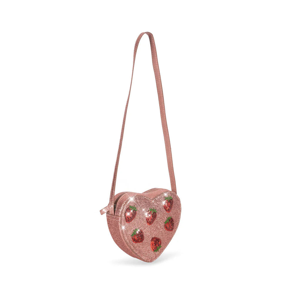 Heart-shaped pink bag with strawberry design on a white background