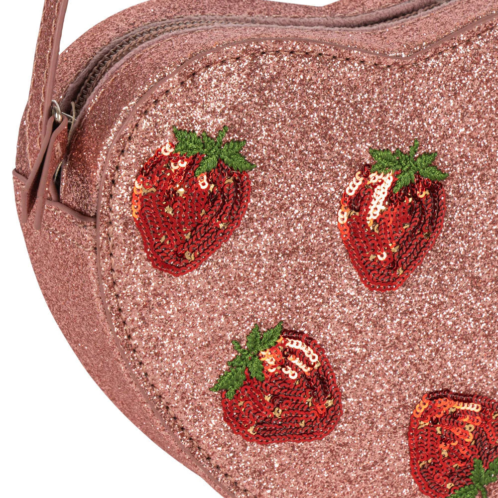 Heart-shaped pink glitter bag with sequin strawberry designs on a white background