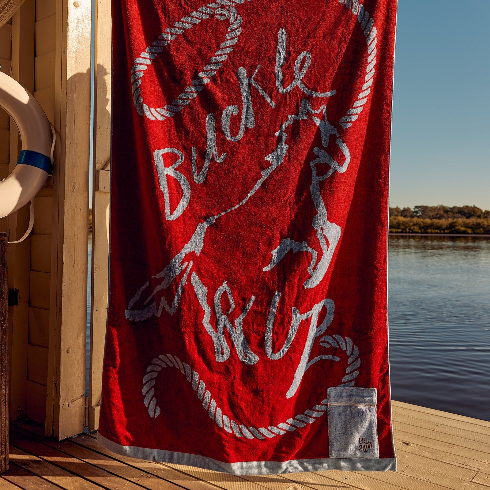 THE SOMEWHERE CO PREMIUM COTTON BEACH TOWEL: BUCKLE UP