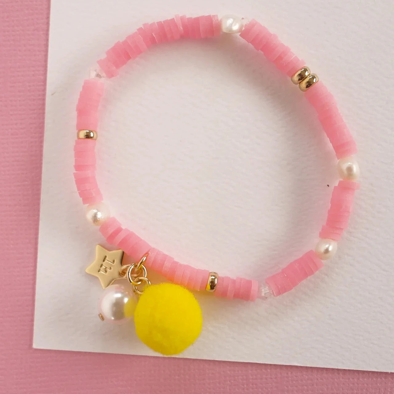 LAUREN HINKLEY POM POM ELASTIC BRACELET: PINK