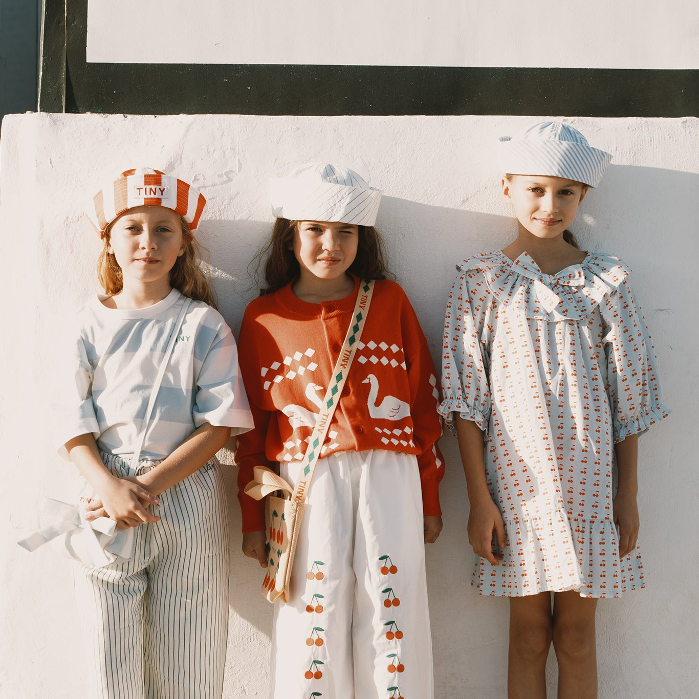 TINY COTTONS SWANS DIAMOND CARDIGAN: SUMMER RED