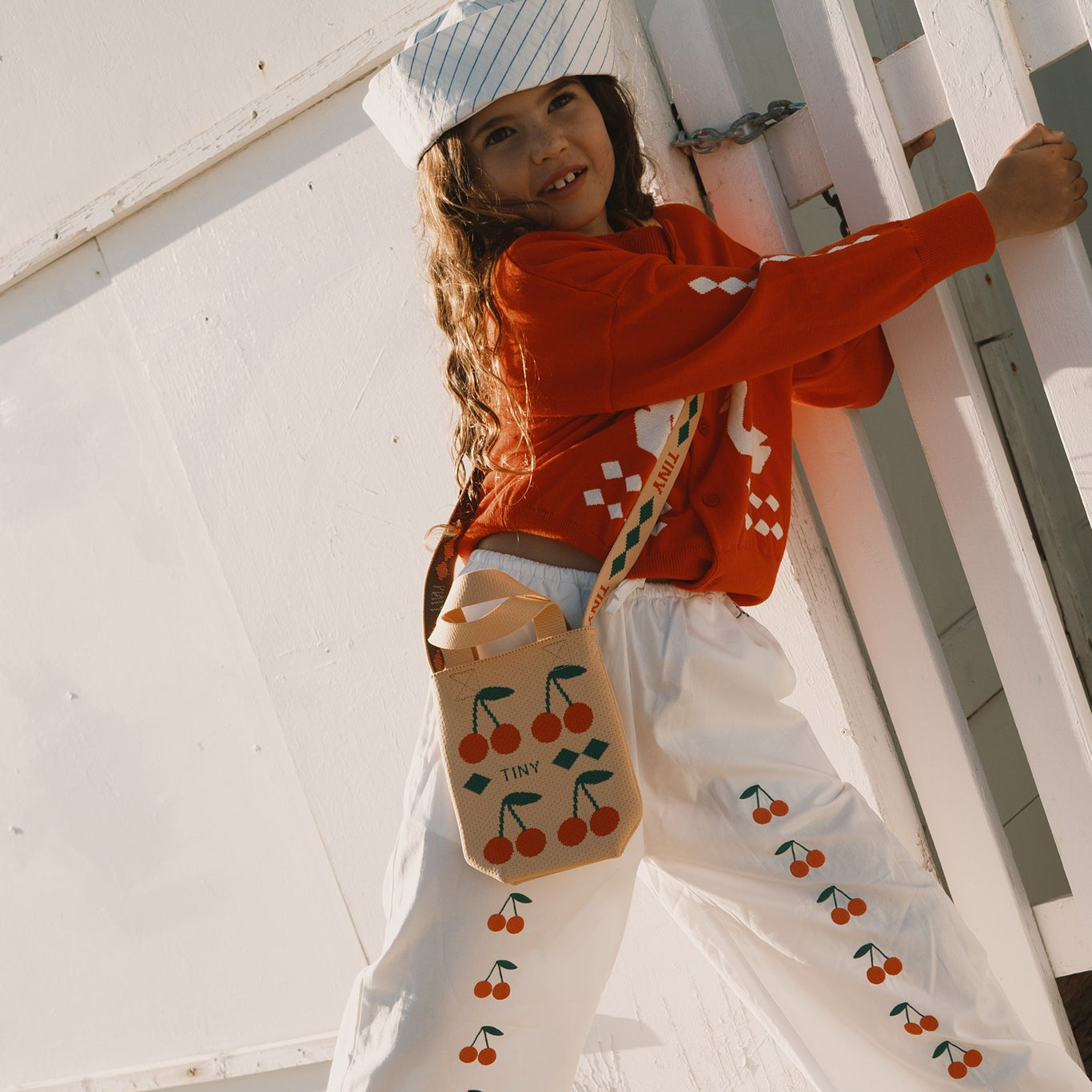 TINY COTTONS SWANS DIAMOND CARDIGAN: SUMMER RED