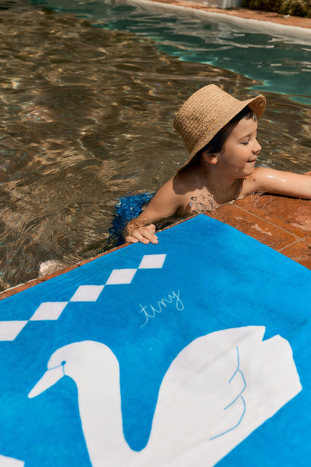Tiny Cottons Swans Towel: Blue - on-model image