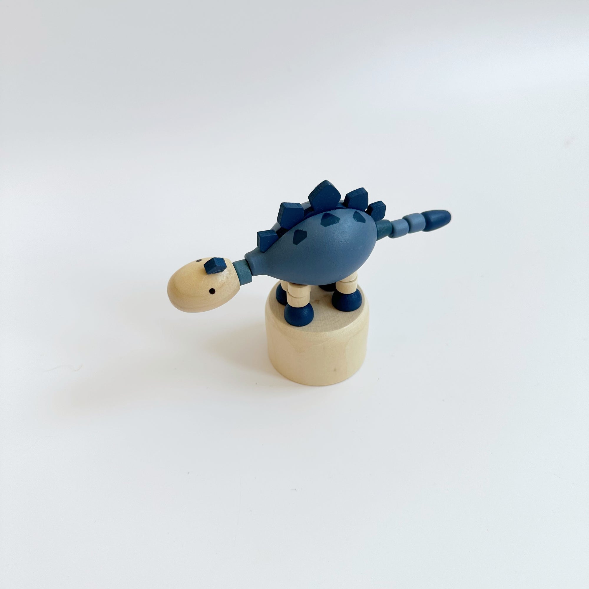 WOODEN DANCING DINOSAUR