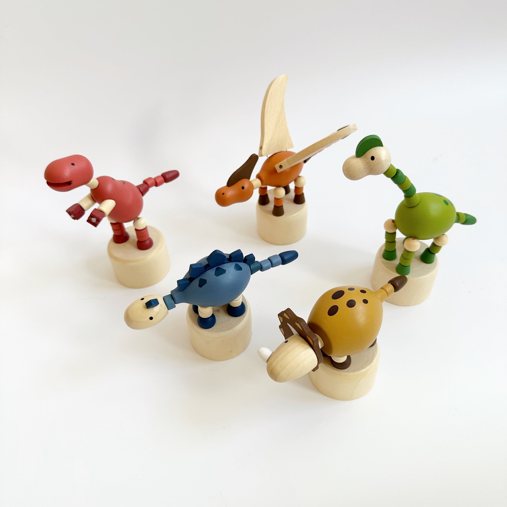 WOODEN DANCING DINOSAUR