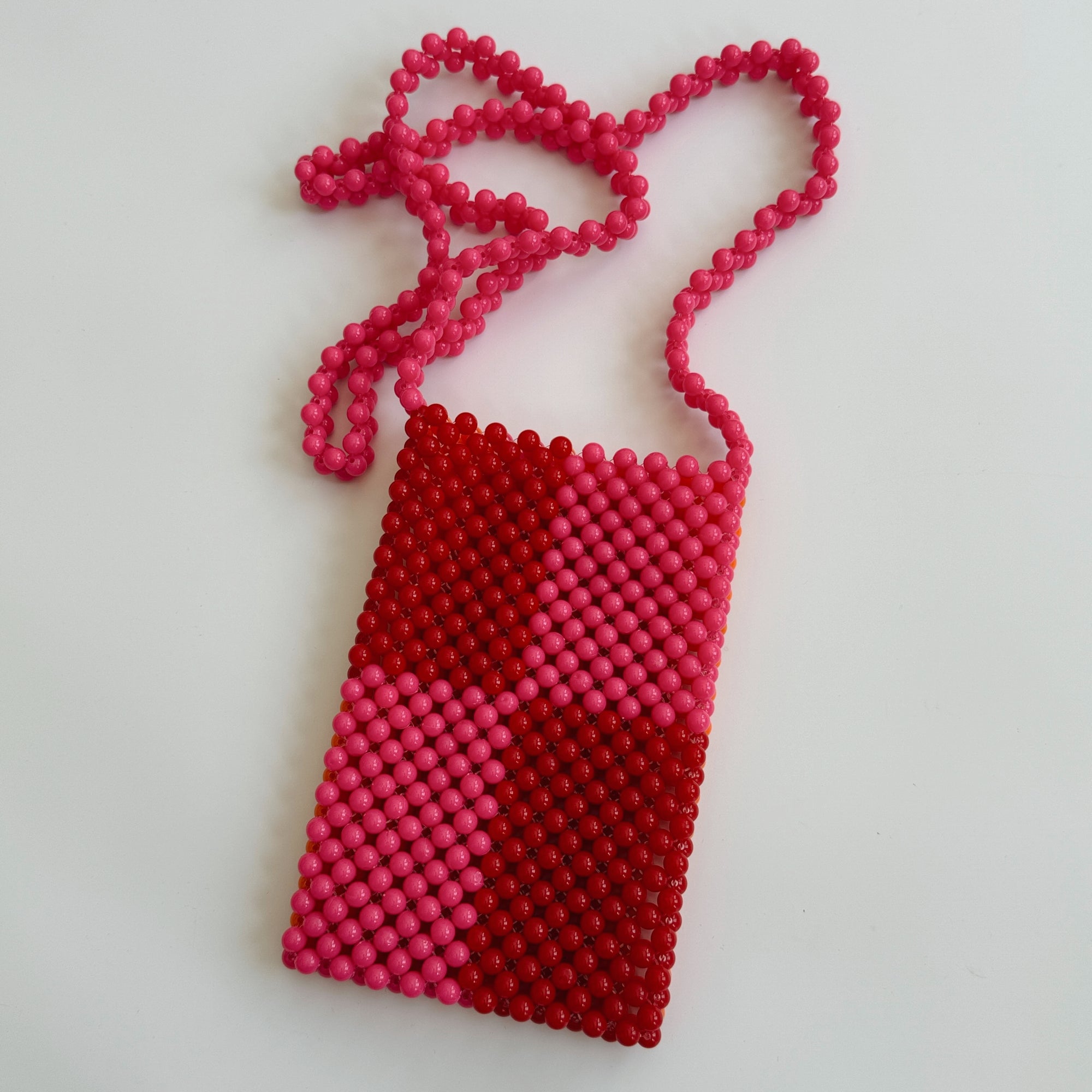 HIBISCUS THE LABEL BEADED PHONE BAG: RED/PINK