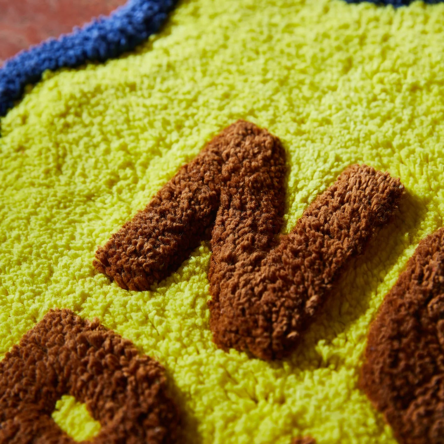 SAGE & CLARE AMALIE NUDIE MINI BATH MAT: DAFFODIL