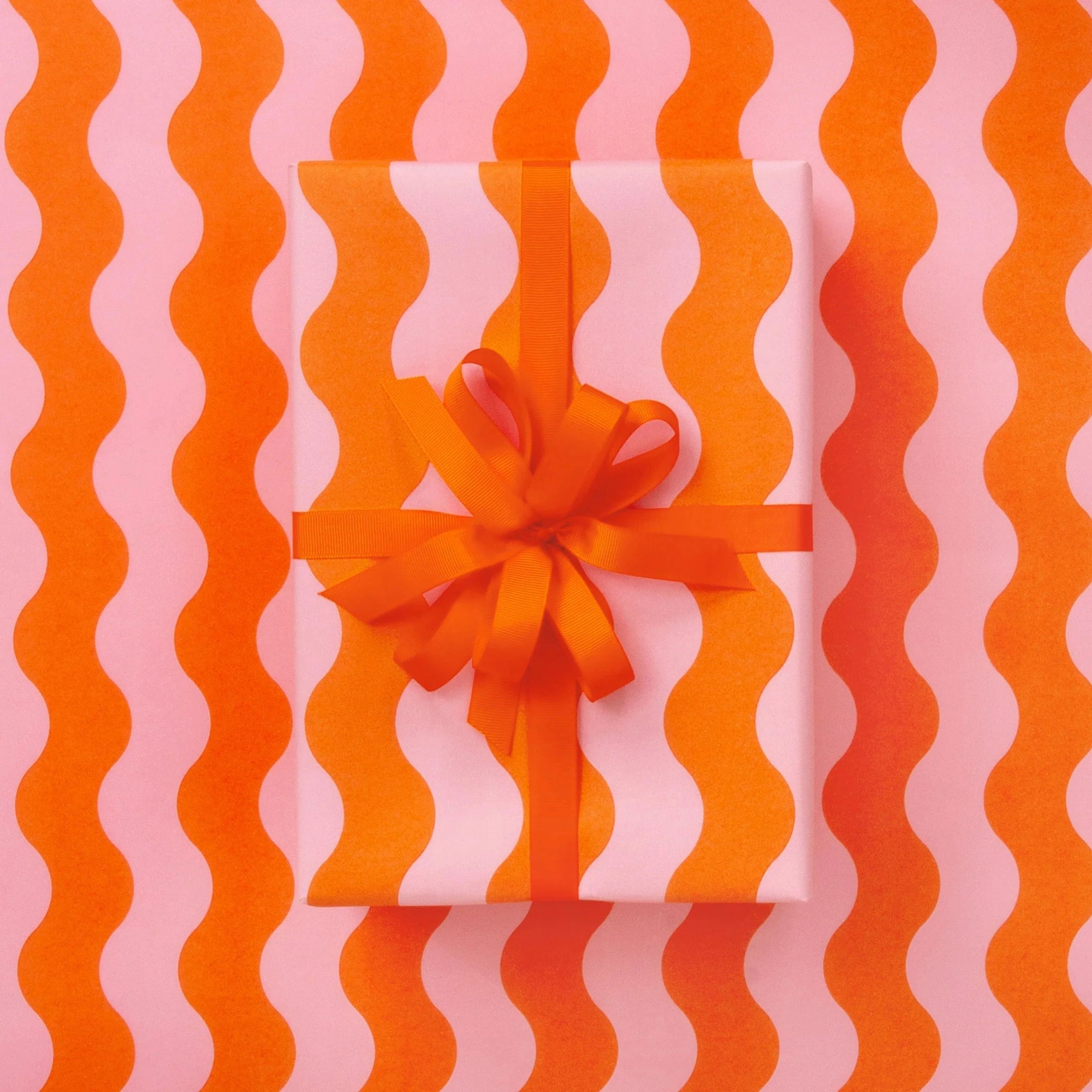 WAVES PINK/ ORANGE WRAPPING PAPER: 2.5M